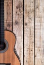 Acoustic guitar on vintage style wood background. Copy space with musical guitar instrument Royalty Free Stock Photo
