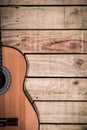 Acoustic guitar on vintage style wood background. Copy space with musical guitar instrument Royalty Free Stock Photo