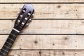 Acoustic guitar on vintage style wood background. Copy space with musical guitar instrument Royalty Free Stock Photo