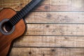 Acoustic guitar on vintage style wood background. Copy space with musical guitar instrument Royalty Free Stock Photo