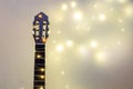 acoustic guitar wrapped in a luminous garland. Christmas gift