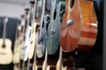 acoustic guitars hanging on a wall in music store Royalty Free Stock Photo