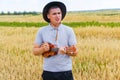 Acoustic instrument. Young beautiful caucasian man playing ukulele outside. Handsome hipster guy plays ukulele guitar on Royalty Free Stock Photo