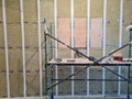 acoustically insulated walls and scaffolding while repair