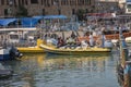 Acre, Israel - 11.05.2018: Active outdoor rest on the Mediterranean sea. Sea trip of group of Arab young people on the rubber boat Royalty Free Stock Photo