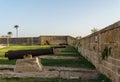 ACRE, ISRAEL - MARCH 23, 2018: Old Acre city walls, Israel. A heavy land defensive wall with cannon outposts.