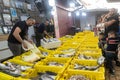 Fish market on a day off. Different varieties of fresh fish in boxes with ice. Sellers sell to