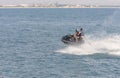 Acre, Israel - 11.05.2018: Sports active rest on the Mediterranean sea. Two young men racing on jet ski. Active summer vacation. Royalty Free Stock Photo