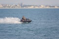 Acre, Israel - 11.05.2018: Sports active rest on the Mediterranean sea. Two young men racing on jet ski, water scooter. Active Royalty Free Stock Photo