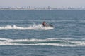 Acre, Israel - 11.05.2018: Sports active rest on the Mediterranean sea. Young man racing on jet ski, water scooter. Active summer Royalty Free Stock Photo
