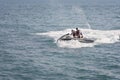 Acre, Israel - 11.05.2018: Sports active rest. Two young men racing on jet ski. Active vacation on the Mediterranean sea Royalty Free Stock Photo
