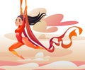 Acrobat on aerial silks. Flying girl against the background of the sky and clouds.