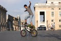 Acrobat boy with bike Royalty Free Stock Photo