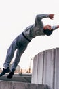 Acrobat man training parkour exercise while jumping backflip Royalty Free Stock Photo