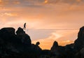 An acrobat walking the slackline