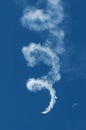 Acrobatic airplane model spiraling towards the ground leaving smoke trail behind