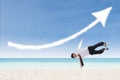 Acrobatic businessman perform success move at beach Royalty Free Stock Photo