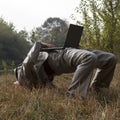 Acrobatic businessman working on laptop Royalty Free Stock Photo