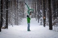 Acrobatic duo making nice pose in the snowy forest during the winter. Concept relationship, happiness and trust Royalty Free Stock Photo