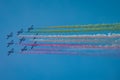 Acrobatic group of Freccia trecolori jet aeroplanes are performing maneouvres in a formation in the italian dolomites close to