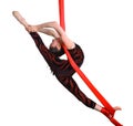 Acrobatic gymnastic girl exercising on red rope