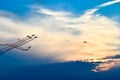 Acrobatic planes in action at an Airshow flying at sunset / dusk Royalty Free Stock Photo