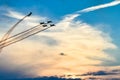 Acrobatic planes in action at an Airshow flying at sunset / dusk Royalty Free Stock Photo