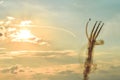 Acrobatic planes doing acrobatics at an Airshow flying at sunset