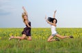 Acrobatic women leaping in unison Royalty Free Stock Photo