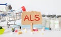the acronym als for Amyotrophic Lateral Sclerosis concept represented by wooden letter.