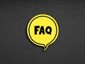 The acronym FAQ frequently asked questions on yellow speech bubble. Business assistance and support