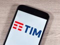 acronym for Telecom Italia Mobile. TIM logo on the smartphone screen Royalty Free Stock Photo