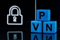 Acronym VPN (Virtual Private Network) made of light blue cubes on dark background with lock. Space for text Royalty Free Stock Photo