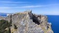 The Acropolis of Lindos in Rhodes island Greece. Saint Paul\'s Beach and Lindos Acropolis aerial panoramic view Royalty Free Stock Photo