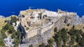 The Acropolis of Lindos in Rhodes island Greece. Saint Paul\'s Beach and Lindos Acropolis aerial panoramic view Royalty Free Stock Photo