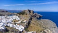 The Acropolis of Lindos in Rhodes island Greece. Saint Paul\'s Beach and Lindos Acropolis aerial panoramic view Royalty Free Stock Photo