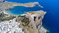 The Acropolis of Lindos in Rhodes island Greece. Saint Paul\'s Beach and Lindos Acropolis aerial panoramic view Royalty Free Stock Photo