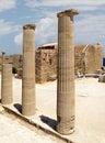 Acropolis of Lindos, the ruins of an ancient temple and the remains of the Doric columns. Lindos, Rhodes, Greece Royalty Free Stock Photo