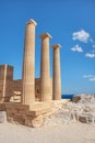 Acropolis of Lindos - Three Doric columns of ancient Temple of goddess Athena Rhodes, Greece Royalty Free Stock Photo