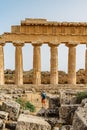 Acropolis of Selinunte,Sicily,Italy.Man traveler enjoying view of ruins of residential and commercial buildings in ancient Greek