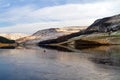 Across the ice to the hills on dove stone reservoir