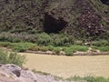 Across the Rio Grande is either a cave or an outcropping casting a shadow