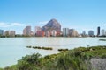 Across salt lake distant view to Parque natural Penon de Ifach or Penyal de Ifac and high rise coastal buildings in Calp Calpe