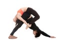 Acroyoga, downward-facing dog and bow pose Royalty Free Stock Photo