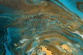 Acrylic Fluid Art. Spots of gold inclusions and aquamarine waves. Abstract Marbleized background or texture