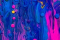 Acrylic paint balls abstract texture. Pink, blue and yellow liquids mix. Creative multicolor background. Bright colors Royalty Free Stock Photo
