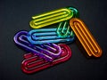 Acrylic paper clips on black background, Rio