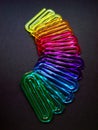 Acrylic paper clips on black background, Rio