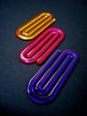 Acrylic paper clips on black background, Rio