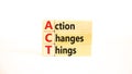 ACT action changes things symbol. Concept words ACT action changes things on wooden blocks on a beautiful white table white Royalty Free Stock Photo